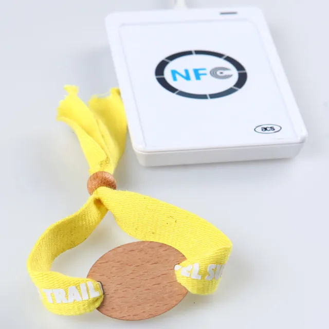 RFID event wristband being tapped on a handheld reader