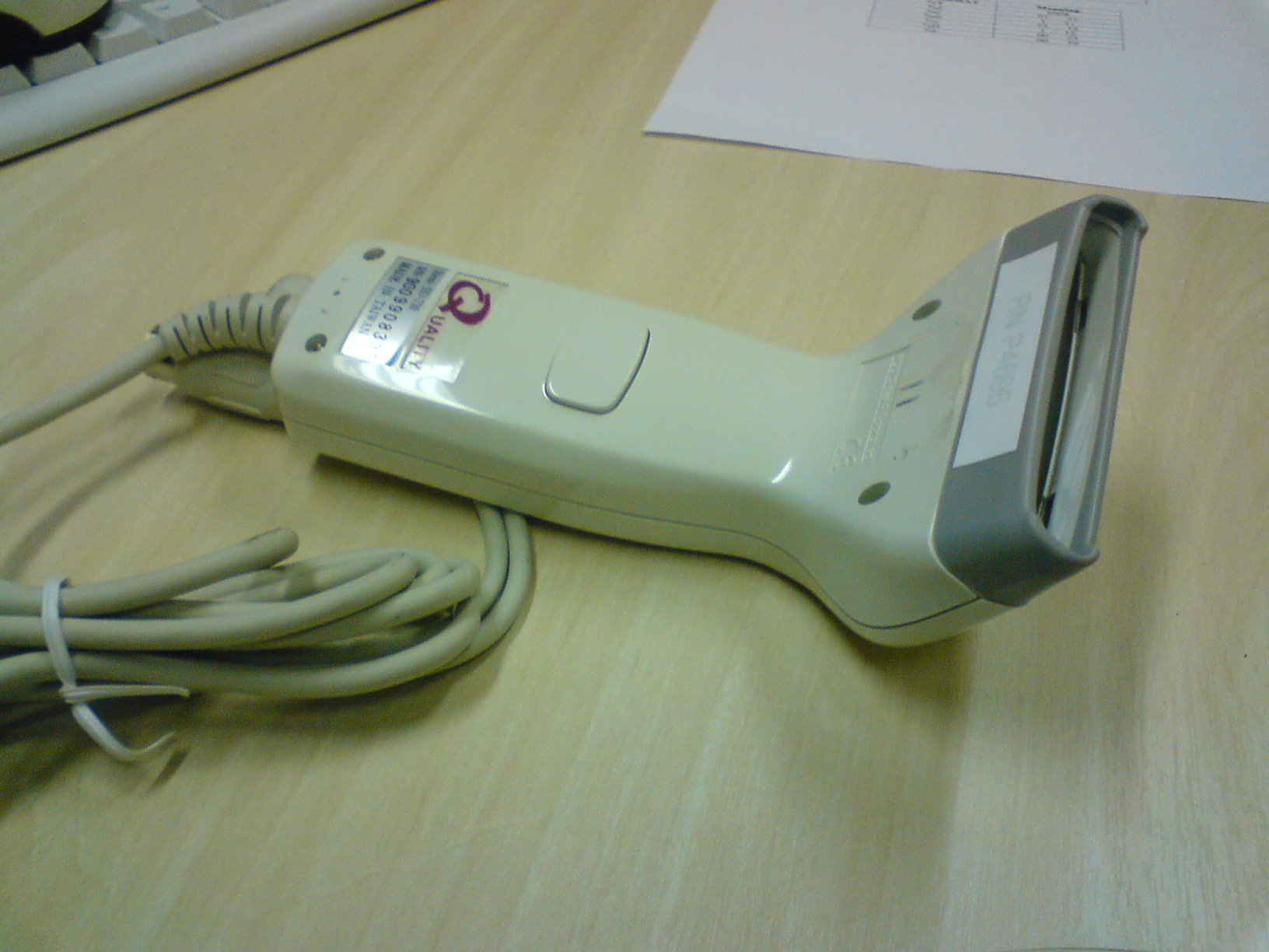 Warehouse technician using a UHF handheld reader to verify palletized inventory